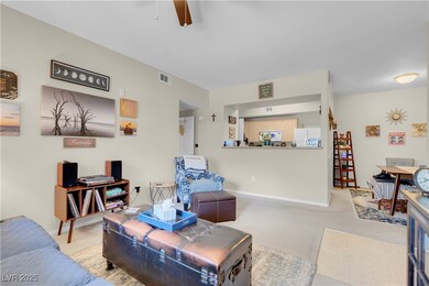 Living room featuring ceiling fan