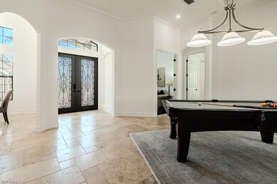 Playroom featuring french doors, a towering ceilin
