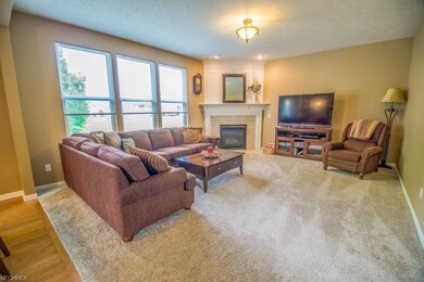 Spacious great room with a beautiful fireplace and tons of natural light.