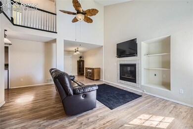 Living room with hardwood / wood-style floors, bui