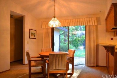 The dining area has a sliding glass door that open