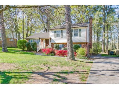The front yard is beautifully landscaped and includes a paved drive.