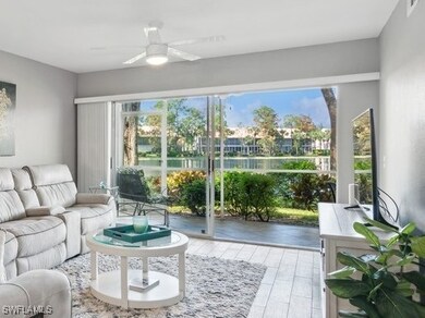 Living room opens to the screened back lanai. Beau