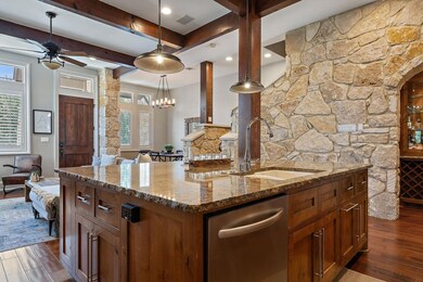 Kitchen featuring dishwasher, a sink, a center is
