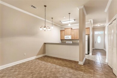 Dining area, front entry and kitchen