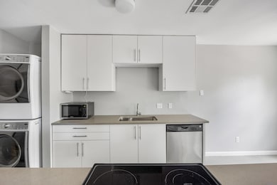 Kitchen with stainless steel appliances, stacked 