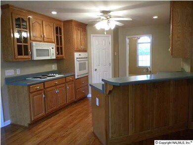 CUSTOM CABINETS, A PANTRY, WOOD FLOORING AND MORE!!