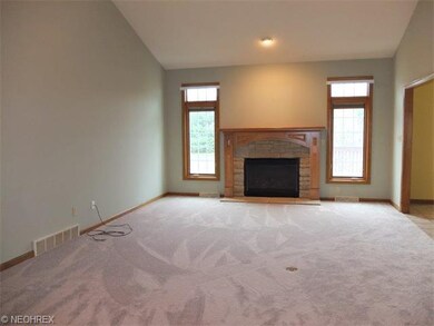 Great room with vaulted ceiling and gas fireplace.
