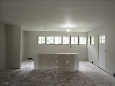 Unfurnished room featuring light colored carpet