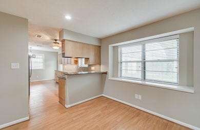 Looking into Kitchen with pass through bar