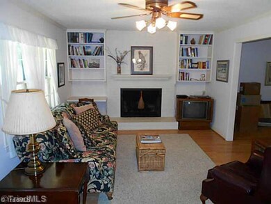 Den/Family/Great Room. Den opens from the kitchen and then into the living room.  Adds great flow to this home.
