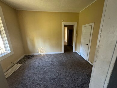 Unfurnished room featuring a textured ceiling and 