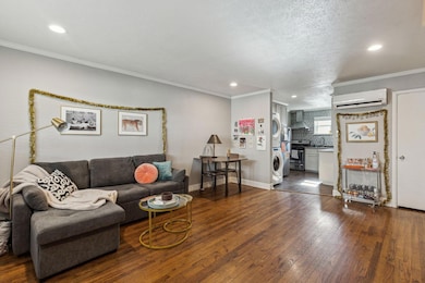 Living room with stacked washer / drying machine, 