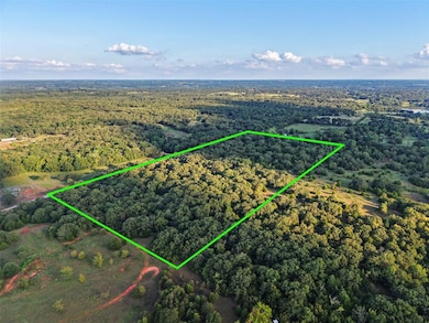 Aerial view of property and surrounding area featuring property boundaries highlighted