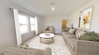Carpeted living room with baseboards