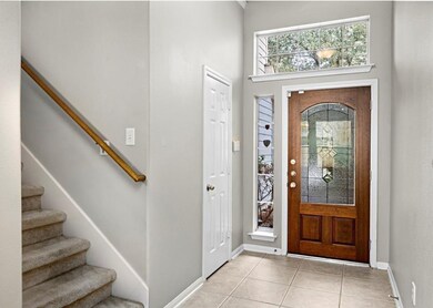 Step into a welcoming entrance featuring a stylish