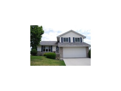 Front Exterior. Partial brick front frames this sp