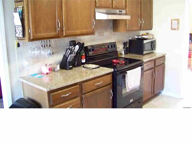 The cook will love the granite counter tops, tiled backsplash.