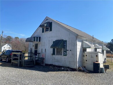 View of property exterior featuring concrete block