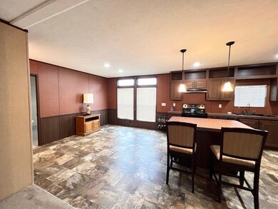Kitchen featuring black / electric stove, under c
