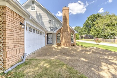 View of side of property with a garage