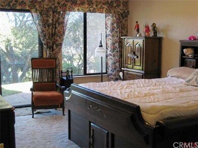 Master bedroom with large walk-in closet and slidi