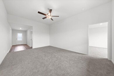 Unfurnished room featuring hardwood / wood-style f