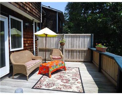 Exterior Back. THE DECK RUNS THE ENTIRE LENGTH OF