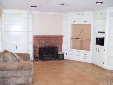 Family Room with Brick Fireplace & Built Ins