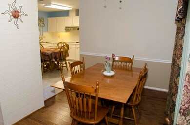 Dining area is open to the kitchen and the backyard, which has a huge deck.