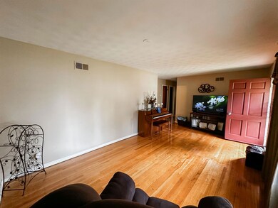 Living room featuring wood-type flooring