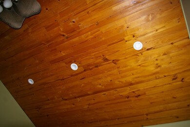 The cathedral ceiling in the great room features d