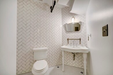 The half bath is conveniently located by the stair