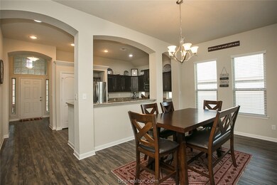 Standing in the living room looking at front door.
