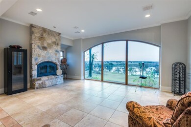 The view here is simply incredible. Overlooking the evening horizon and the 15 acre lake. Floor to ceiling stone wood burning fireplace will add warmth and ambiance in the cooler months.