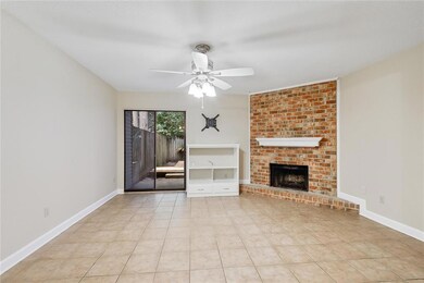 View of Living room with wood burning Fireplace.