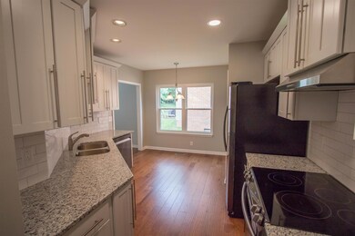 Beautiful eat in kitchen with granite counter tops.