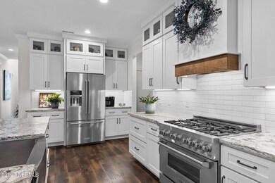 beautiful vent hood and gas stove top