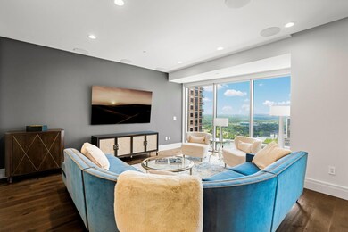 Living room featuring wood finished floors, baseb