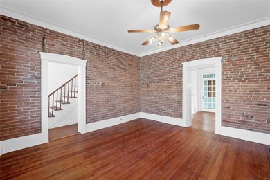 Living room with view from foyer to dining room.