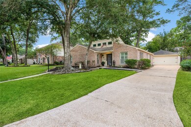 It has a long driveway for plenty of parking and a detached, two-car garage.