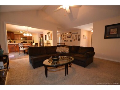 Living room opens to the dining area and kitchen.