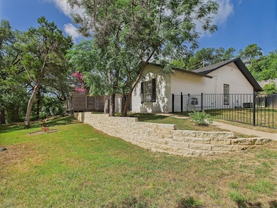 Rear view of property featuring brick siding