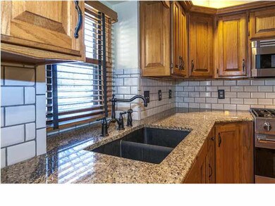 Composite sink and polished bronze faucet in the k