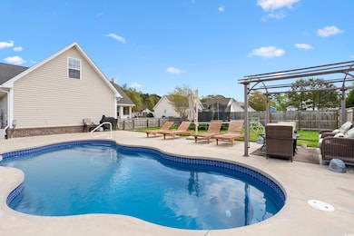 View of pool featuring a patio, a fenced in pool, a trampoline, and a fenced backyard