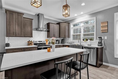 Kitchen with Stainless Appliances and Vented Hood