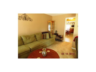 Living room freshly painted.  Notice sofa length a