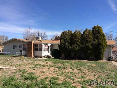 This home offers a large yard with fencing, and an