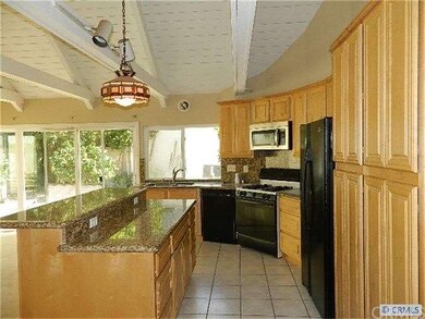 Another look at the kitchen with granite counters