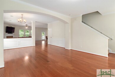 lLarge open concept with arched passageways